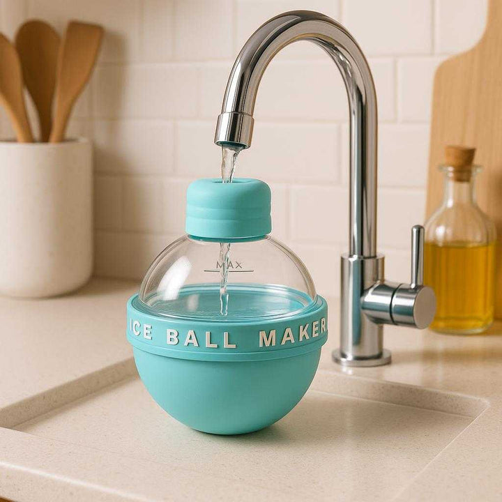 Dekorationer med Is Skulpturer - Elegant Interiør i Blå, Gul, Lilla, Lyserød. A stylish kitchen countertop with the ice ball maker in the process of being filled with water from a sleek chrome faucet, encapsulating a modern and efficient lifestyle.