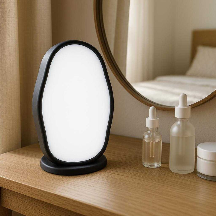 Effektiv Krystal Hårfjerner til Naturlig Hårfjerning - Professionel og Høj Kvalitet til Silkeblød Hud: A different realistic bedroom vanity setting where the product is securely positioned on a wooden vanity table, naturally placed next to a mirror and skincare products.