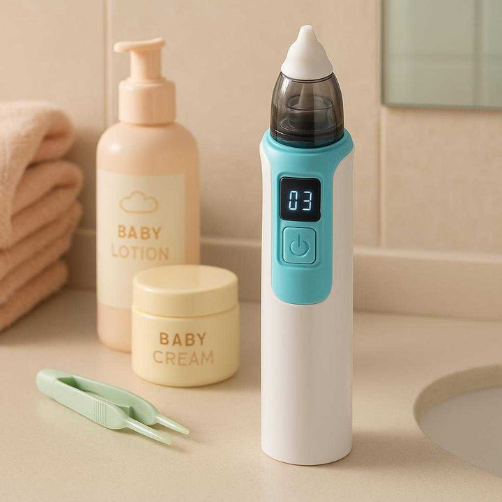 Elektrisk Næsesuger til Baby med LED - Skånsom og Effektiv Snottetæmning i Hvid og Lyseblå: A different realistic bathroom setting where the nasal aspirator is securely positioned on a countertop next to baby skincare products, naturally placed to show readiness for use.