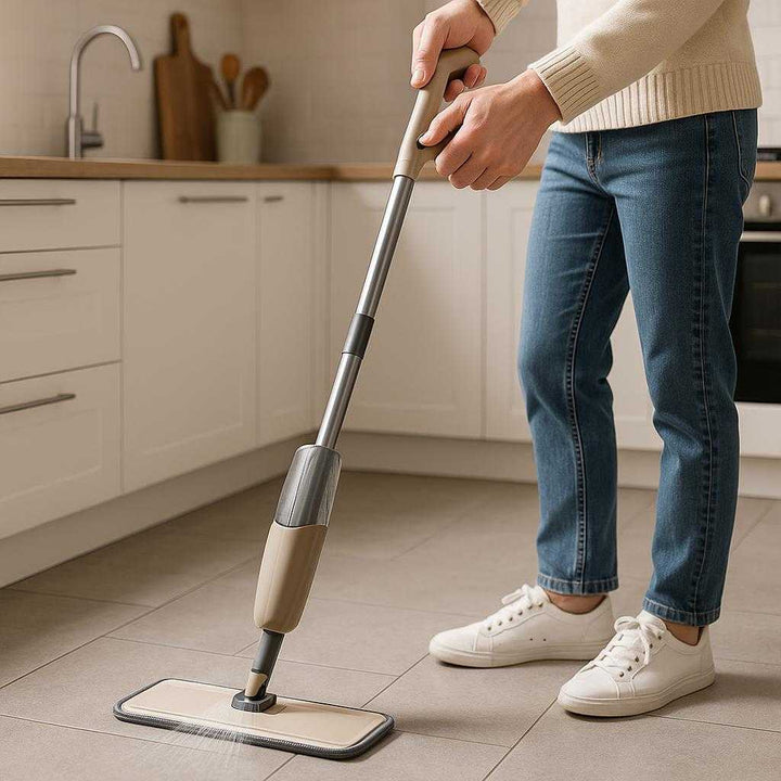 Genopfyldelig Spraymoppe med Høj Kvalitet til Effektiv Rengøring af Gulve i Moderne Design: A realistic modern kitchen with sleek tile flooring where the Genopfyldelig Spraymoppe is properly grounded on the floor, being actively used by a person.