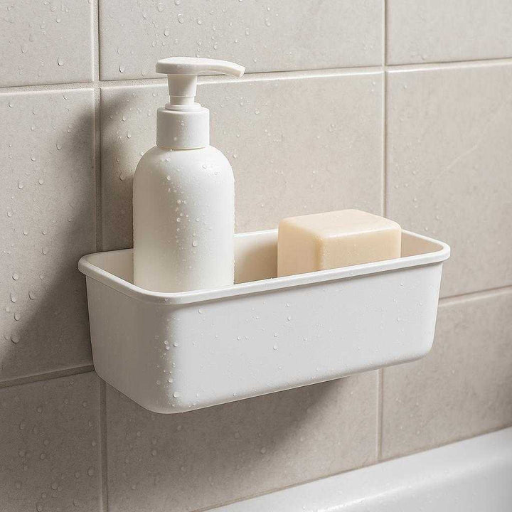 Køkken opbevaringsmodul i hvid plast - Væghængt design med skjult montering: A different realistic bathroom setting where the product is securely positioned on a tiled bathroom wall, being used to hold toiletries such as shampoo and soap, naturally integrated into the decor, with proper physics observed as water droplets are shown on the surface from a recent shower, and realistic shadows and integration into the environment being highlighted by ambient bathroom lighting.