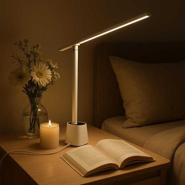 Ledlæselampe med justerbar arm og USB-opladning - Moderne og kompakt design i hvid eller sort: A tranquil bedroom environment, where the LED reading lamp is elegantly placed on a minimalist bedside table next to a vase of fresh flowers and a peaceful candle.