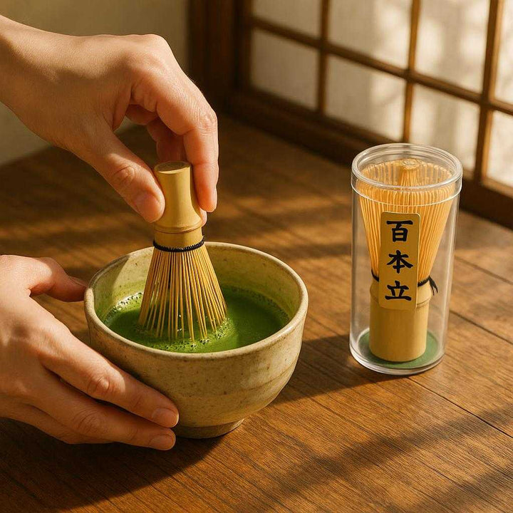 Matcha Piskeris i Bambus - Traditionelt Japansk Teudstyr til Perfekt Skummet Matcha: A realistic Japanese tea ceremony setting where the Matcha Piskeris i Bambus is properly grounded on a traditional wooden table, being actively used by a person's hands to whisk matcha in a ceramic bowl, with natural sunlight filtering through a window, casting realistic shadows and showing clear contact points where the whisk touches the bowl.