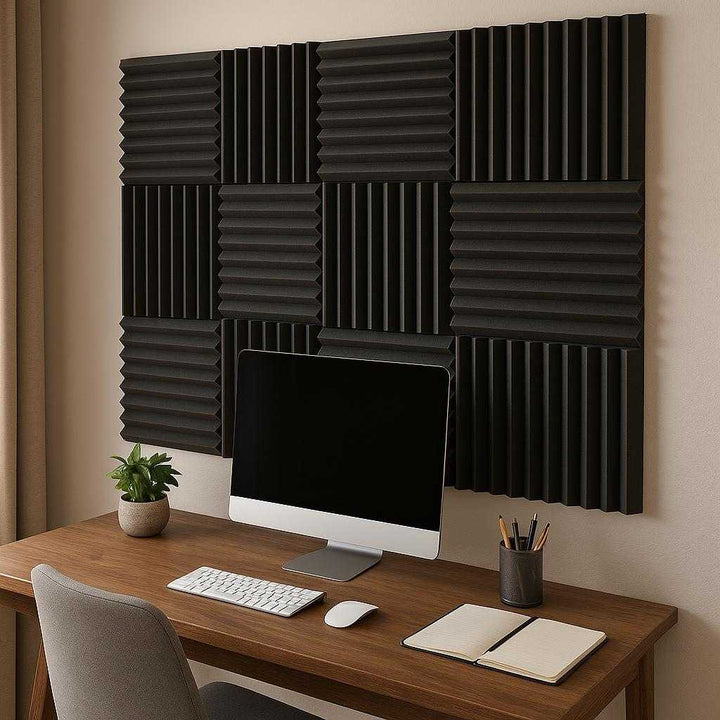 Perfekt Lydabsorberende Akustikpaneler i Sort Skum - Ideel til Kontor, Hjemmebrug og Optagelsesstudier: A realistic home office setting where the acoustic panels are properly grounded on a wall above a sleek wooden desk, being naturally integrated into the decor with a computer and stationery nearby.