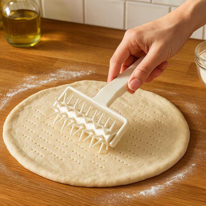 Pizzaskærer i Plastik - Hvid, Forhindrer Bobler, Let at Bruge, Standard Kvalitet, 'S/M' = 'S/M': A realistic kitchen setting where the Pizzaskærer i Plastik is properly grounded on a wooden countertop, being actively used by a person's hand to poke holes in a fresh pizza dough spread on a floured surface, with natural lighting casting realistic shadows and showing clear contact points where the product touches the dough, creating an authentic preparation scene.