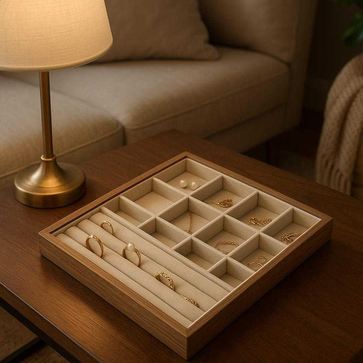 Premium Smykkeskrin i træ med spejl – Elegant opbevaring til smykker: A different realistic living room setting where the product is securely positioned on a coffee table, displaying various jewelry pieces within its compartments as part of a cozy interior decor, with proper physics, shadows from a nearby lamp, and realistic integration into the elegant and inviting environment.