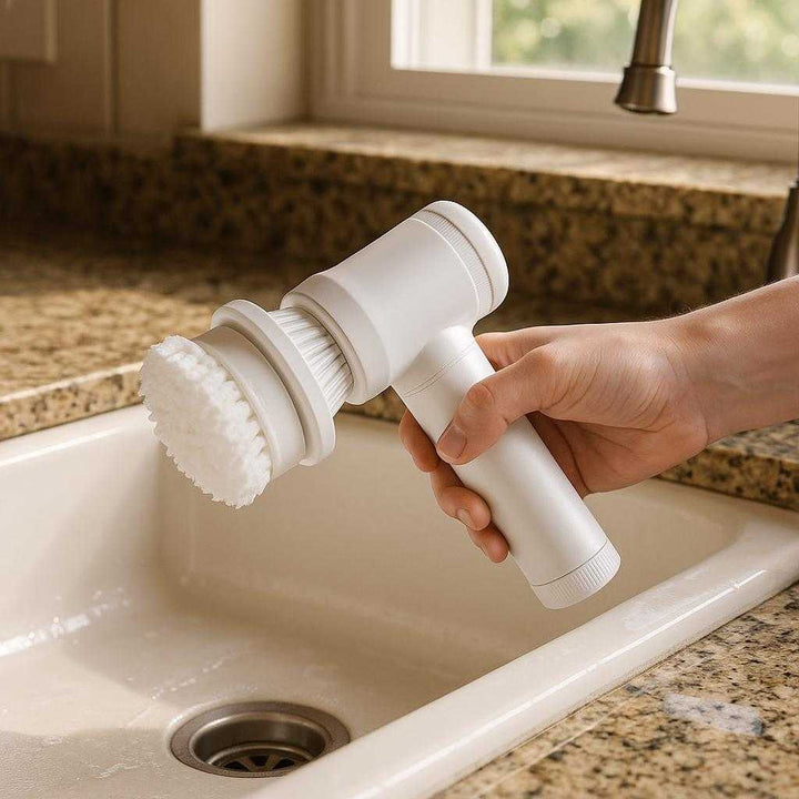 Rengøringsbørste Elektrisk til Effektiv Rengøring - Høj Kvalitet og Ergonomisk Design: A realistic kitchen setting where the product is properly grounded on a granite countertop, being actively used by a person's hand to clean a ceramic sink, with natural morning light filtering through a nearby window, casting realistic shadows and showing clear contact points where the product touches the sink surface.