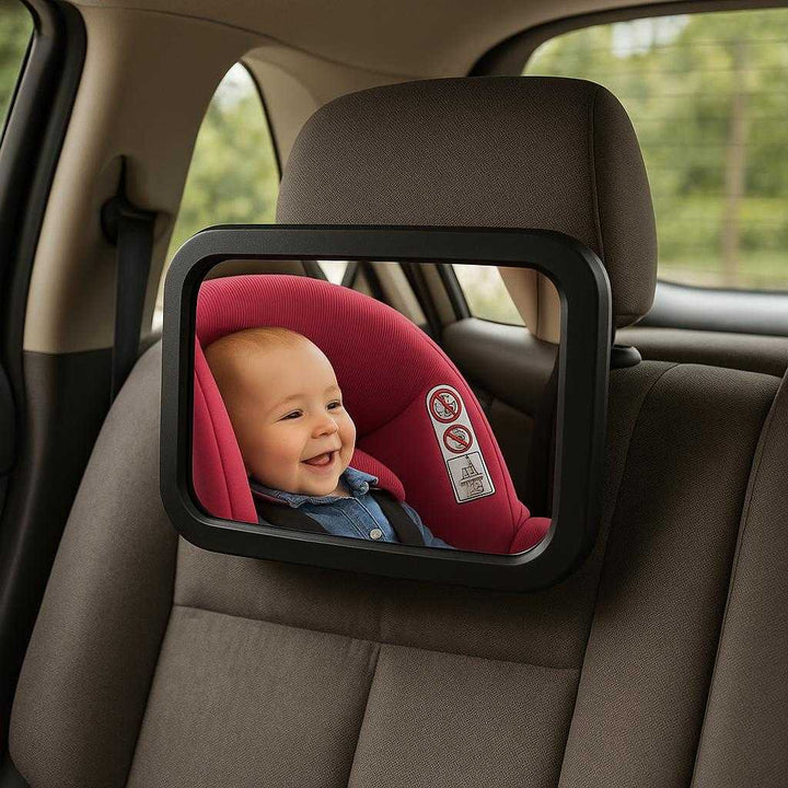 Sikkerhedsspejl i Sort - Plastik og Drikkeglas, 360 Graders Rotation, God Kvalitet: A realistic car interior with a rear-facing baby seat, the Sikkerhedsspejl i Sort securely attached to the backseat headrest, reflecting a clear view of a happy baby.