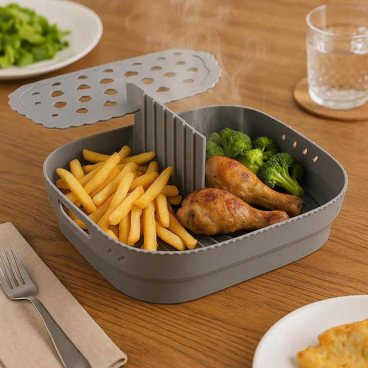 Silikoneform med Opdeler til Airfryer - Høj Kvalitet, Praktisk og Holdbar Kvadratisk Design: A different realistic dining table setting where the silicone air fryer divider is securely positioned on a wooden table, being used to serve freshly cooked food in separate sections, with the divider naturally separating different food items.
