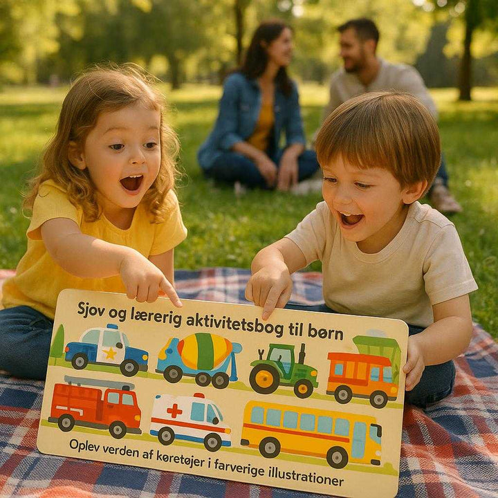 Sjov og lærerig aktivitetsbog til børn - Oplev verden af køretøjer i farverige illustrationer. The 'Sjov og lærerig aktivitetsbog til børn - Oplev verden af køretøjer i farverige illustrationer' lies open on a picnic blanket in a sunny park, with children pointing excitedly at the vivid vehicle illustrations as parents engage in the background.