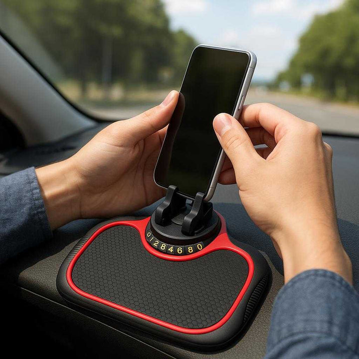 Skridsikker Mobilholder til Bilen - Justerbar og Praktisk Telefonholder i Høj Kvalitet: A realistic car interior where the product is properly grounded on the dashboard, being actively used by a driver who is adjusting the phone holder to fit their device, with natural daylight streaming through the windshield, casting realistic shadows and showing clear contact points where the product touches the dashboard.