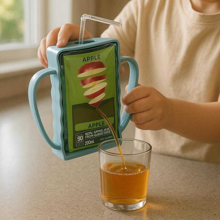 Taske Holder i Plastik - Lyseblå og Lys Lilla, Forhindrer Spild, Nem at Bære: A realistic kitchen counter setting where the Taske Holder i Plastik is properly grounded on a smooth countertop, being actively used by a child pouring juice from the package into a cup.