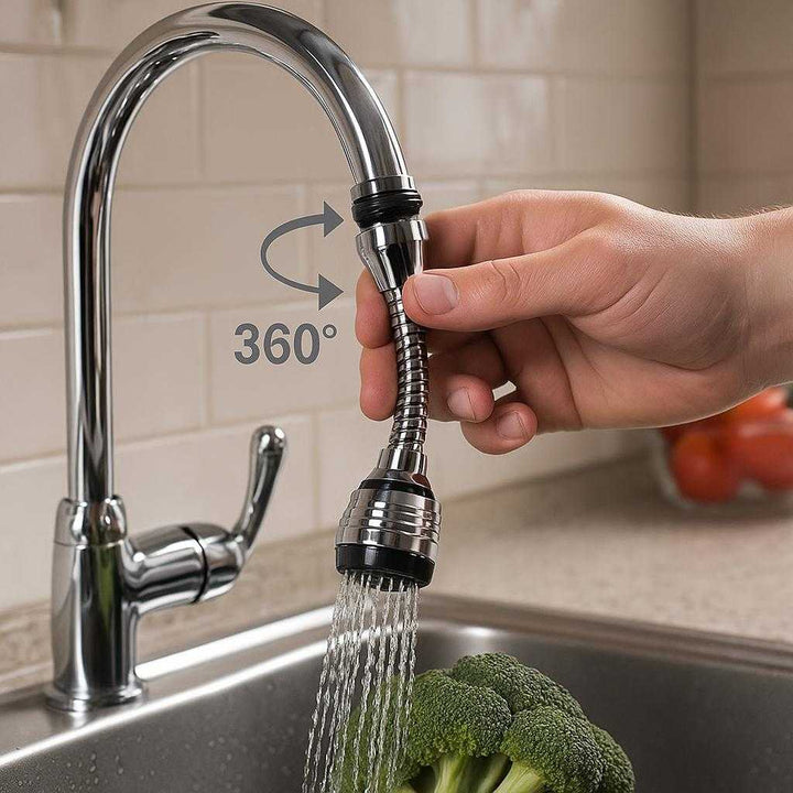 Vandhaneforlænger i Sort med 360 Graders Roterende Funktion - Høj Kvalitet for Køkken & Bad: A realistic kitchen setting where the product is properly grounded on a kitchen sink faucet, being actively used by a hand adjusting the swivel function to rinse vegetables in the sink.
